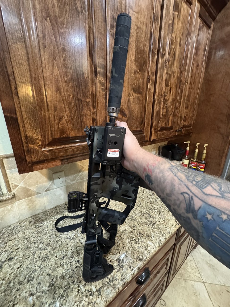 Spotter G on a camo-wrapped rifle build