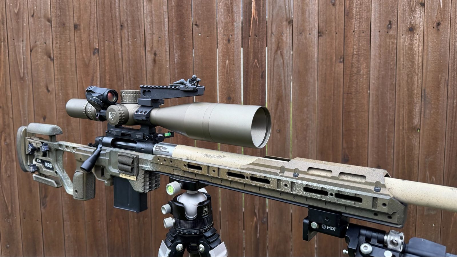 Spotter G mounted on a full scoped precision rifle on a tripod