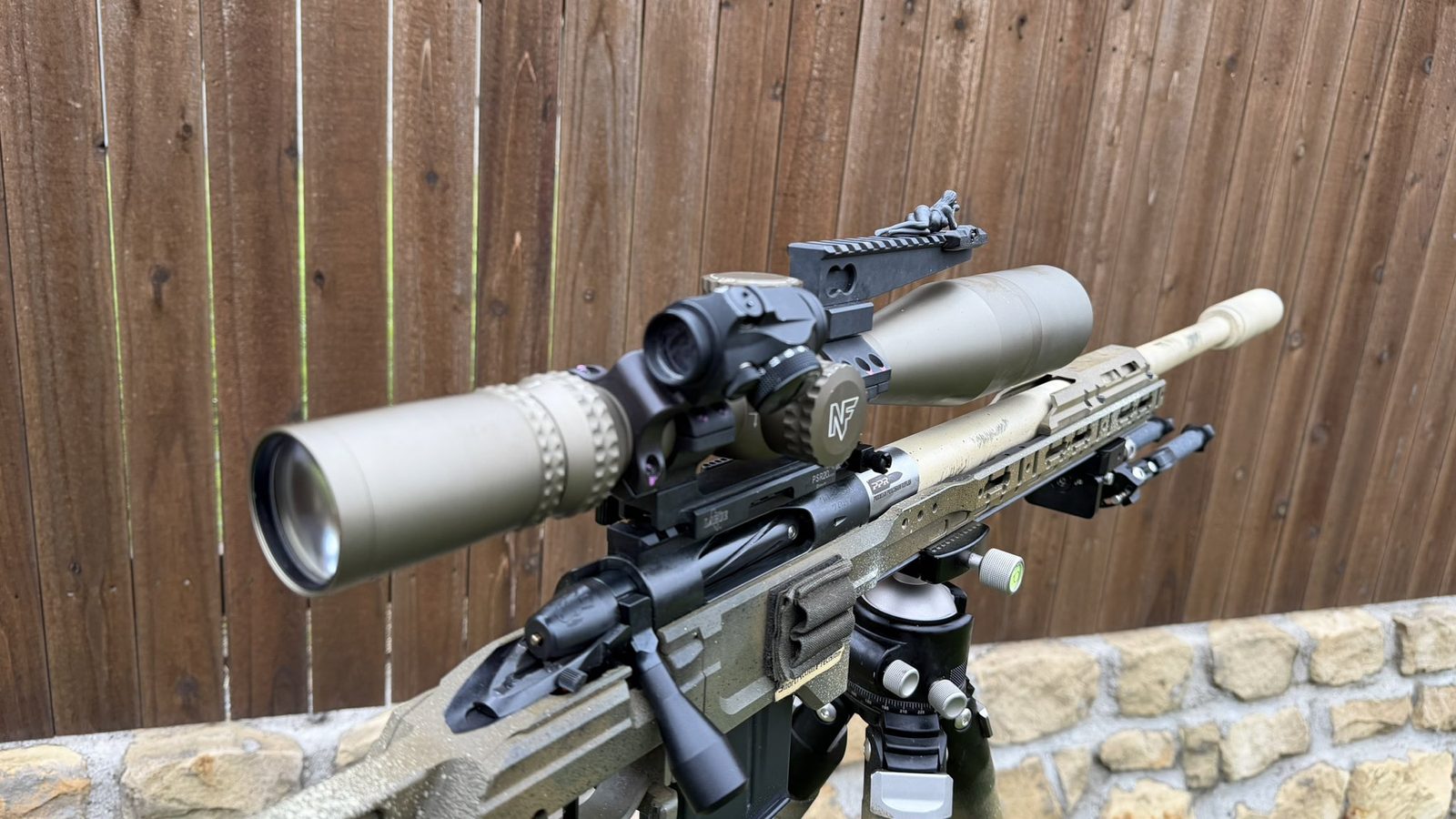 Three-quarter view of Spotter G on a scoped precision rifle